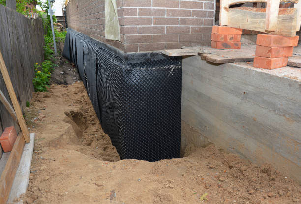 Happy homeowners after waterproofing job in Echola